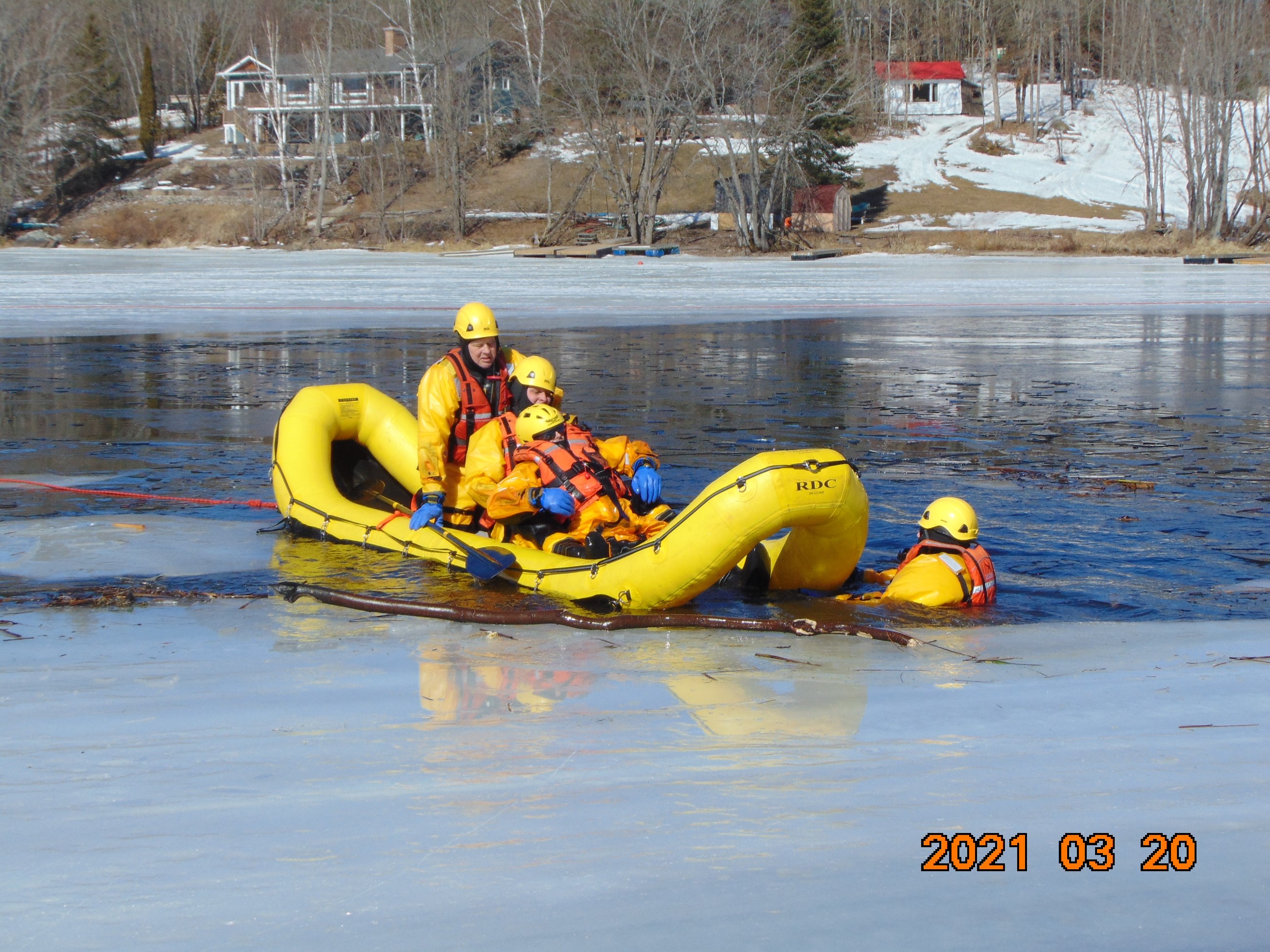 Members of the Dysart Fire Department in a Raft Practicing Ice Training